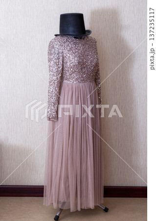 A beautiful women's dress on a mannequin with a hat A beautiful women's dress on a mannequin with a hat 137235117