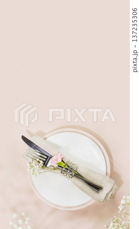 Rustic Wedding Table Setting With Knife And Fork Wrapped In Linen On Plate 137235306