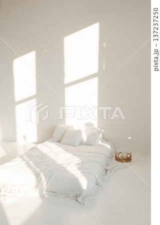 Minimalist Bedroom Interior With White Bed And Sun Light Shadows Minimalist Bedroom Interior With White Bed And Sun Light Shadows 137237250