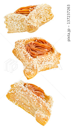 Cakes with brown cream and nuts, set, falling, hanging, flying, soaring, isolated on white background Cakes with brown cream and nuts, set, falling, hanging, flying, soaring, isolated on white background 137237263