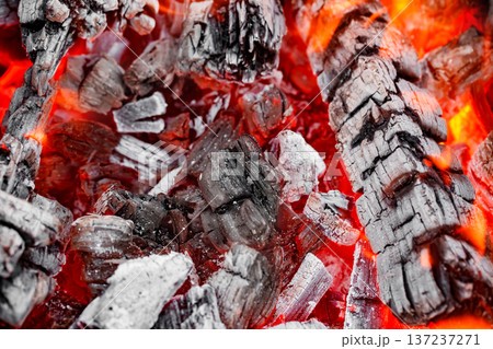 Embers of wood smoldering burning, close-up, selective focus Embers of wood smoldering burning, close-up, selective focus 137237271