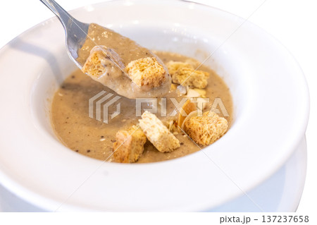 Die cut of pumpkin Soup with Almond and Crispy Bread Toast on white isolated 137237658