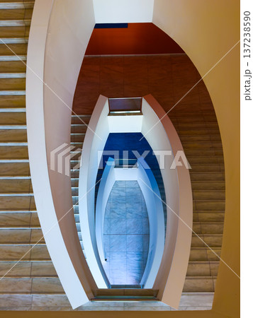 Modern curved staircase and geometric spiral architecture interior, overhead view 137238590