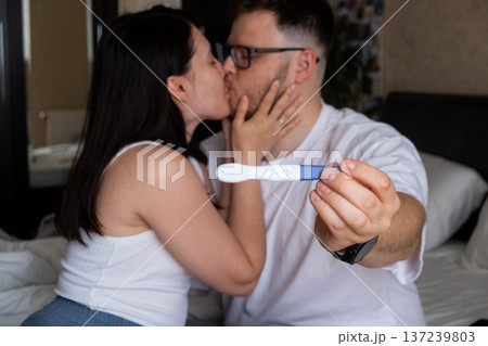 Happy Couple Celebrating Positive Pregnancy Test Happy Couple Celebrating Positive Pregnancy Test 137239803