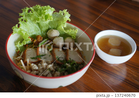 Traditional Sukhothai Tom Yum Rice Noodles with Sliced Long Beans, Red Pork, and Soft-Boiled Egg Traditional Sukhothai Tom Yum Rice Noodles with Sliced Long Beans, Red Pork, and Soft-Boiled Egg 137240670