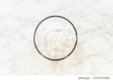 The glass bowl now contains all ingredients for Simple White Royal Icing, ready to be mixed into a smooth icing. The glass bowl now contains all ingredients for Simple White Royal Icing, ready to be mixed into a smooth icing. 137241681