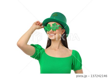 Woman in green hat and shamrock glasses smiling, isolated, PNG Woman in green hat and shamrock glasses smiling, isolated, PNG 137242146