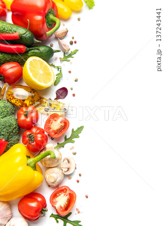 Fresh organic vegetables and spices bordering white background Fresh organic vegetables and spices bordering white background 137243441