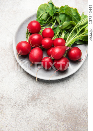 Fresh organic radish vegetables on plate for healthy eating Fresh organic radish vegetables on plate for healthy eating 137243445