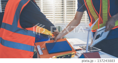 Concept Architect and desk of Architectural project in construction site or office building with mining light Concept Architect and desk of Architectural project in construction site or office building with mining light 137243883