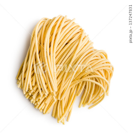Fresh pasta ready for cooking, showing strands of bigoli set on a white background 137247831