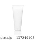 Blank white plastic tube containing cosmetic cream, lotion, or skincare product standing upright on a reflective white background, ready for brand design and advertising mockup 137249108