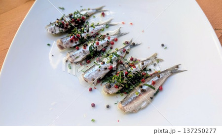 Marinated sardines with mixed color peppercorns and herb 137250277