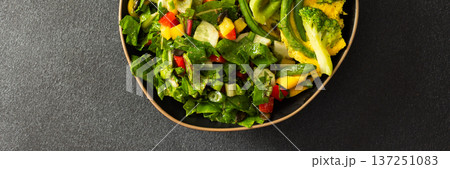 This healthy breakfast consists of a quinoa bowl served with boiled eggs, green beans, and broccoli, alongside a fresh salad. It offers a nutritious start to the day, banner 137251083