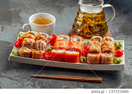 Assorted sushi rolls with tea set 137251660
