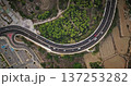 Malta: Cars driving scenic highway road with lush greenery and fields, breathtaking aerial perspective of the island's infrastructure traffic and natural beauty. Drone flight , top down view Malta: Cars driving scenic highway road with lush greenery and fields, breathtaking aerial perspective of the island's infrastructure traffic and natural beauty. Drone flight , top down view 137253282