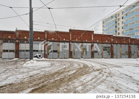 Frosty warehouse scene. Urban garage with snowy surroundings Frosty warehouse scene. Urban garage with snowy surroundings 137254138