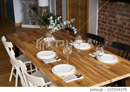 Intimate meal setting featuring rustic decor and fresh flowers 137254170