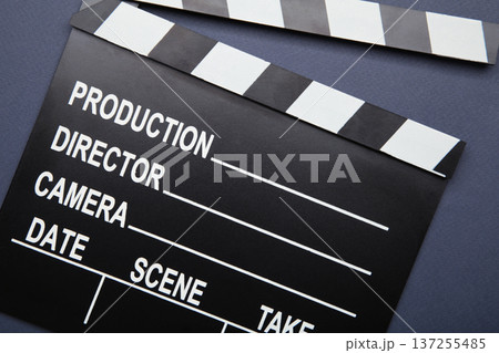 One movie clapper on dark blue background. Film industry 137255485