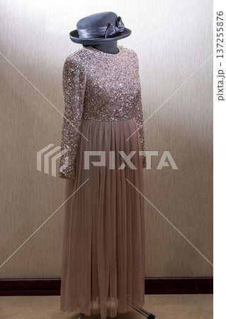 A beautiful women's dress on a mannequin with a hat A beautiful women's dress on a mannequin with a hat 137255876