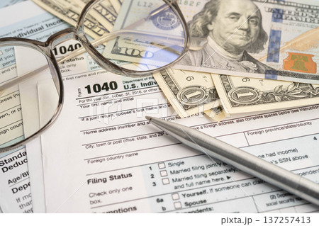 Tax form 1040 U.S. Individual Income Tax Return and bitcoin, business finance, Digital currency, Virtual cryptocurrency. 137257413