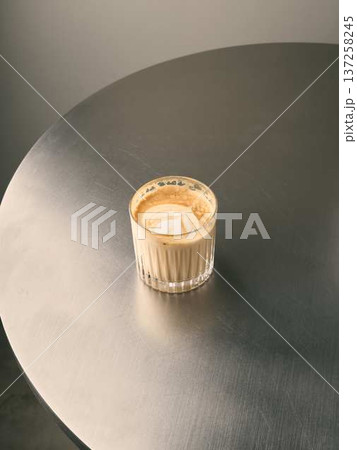 Upscale cafe scene with warm beverage and sleek surface Upscale cafe scene with warm beverage and sleek surface 137258245