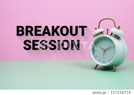 Black alarm clock on a pastel green and pink background with the text "Breakout session" Black alarm clock on a pastel green and pink background with the text "Breakout session" 137258774
