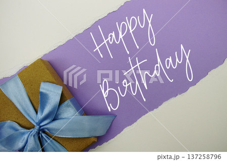 Happy Birthday text with gift box present on purple background 137258796