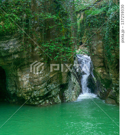 Waterfall and lake in canyon in deep forest Waterfall and lake in canyon in deep forest 137259330