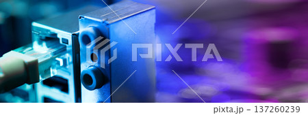 Fiber optic cables connected to optical ports and network cables connected to internet ports. High quality photo Fiber optic cables connected to optical ports and network cables connected to internet ports. High quality photo 137260239