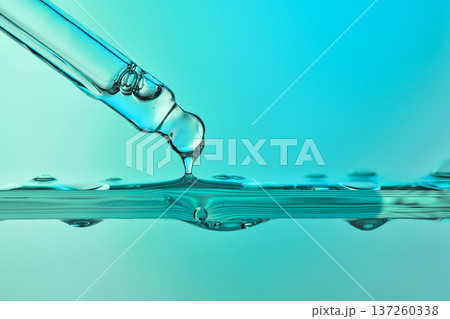 Pipette dripping liquid serum drop for skincare hydration 137260338