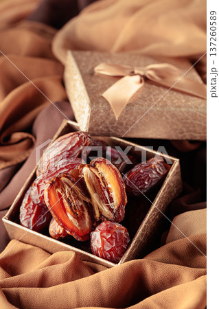 Dates fruits in golden gift box. 137260589