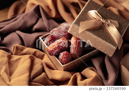 Dates fruits in golden gift box. 137260590