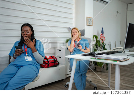 Exhausted nurses taking a short break during long hospital shift 137261387