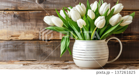 Elegant white tulips in a rustic ceramic vase on a wooden table during spring season Elegant white tulips in a rustic ceramic vase on a wooden table during spring season 137261825