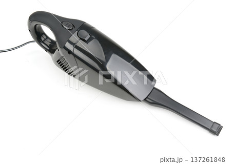 Compact Black Automotive Vacuum Cleaner with Nozzle and Cord Isolated on White Background Compact Black Automotive Vacuum Cleaner with Nozzle and Cord Isolated on White Background 137261848