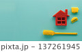 Creative house cleaning tools arranged on a turquoise background for home cleaning concept 137261945
