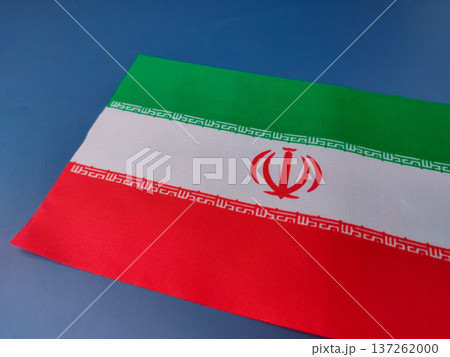 The image shows the national flag of Iran on a blue background. The image shows the national flag of Iran on a blue background. 137262000