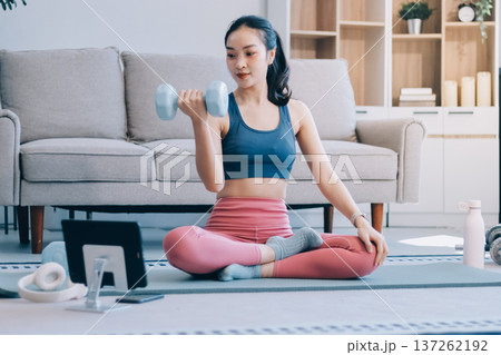 Young Asian sporty attractive people practicing yoga lesson with instructor. Asia group of women exercising healthy lifestyle in fitness studio. Sport activity, gymnastics or ballet dancing class. 137262192