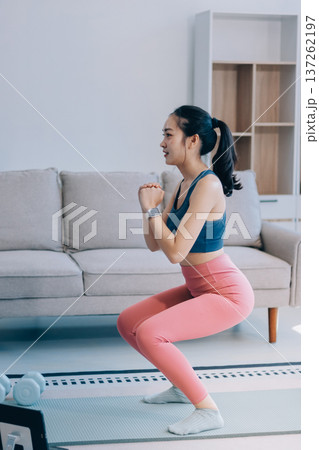 Young Asian sporty attractive people practicing yoga lesson with instructor. Asia group of women exercising healthy lifestyle in fitness studio. Sport activity, gymnastics or ballet dancing class. 137262197