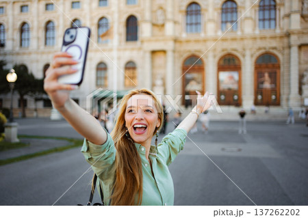 Happy young adult woman taking selfie in Vienna Happy young adult woman taking selfie in Vienna 137262202