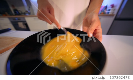Baker combines ingredients. Morning baker mixes egg components 137262478