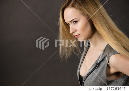 Beautiful woman having serious face expression Beautiful woman having serious face expression 137263645