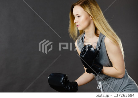 Boxer girl exercise with boxing gloves. Boxer girl exercise with boxing gloves. 137263684