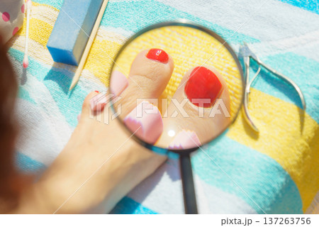 Woman magnifying pedicure 137263756