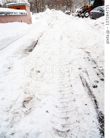 clearing of snowy road in city courtyard in winter clearing of snowy road in city courtyard in winter 137264755