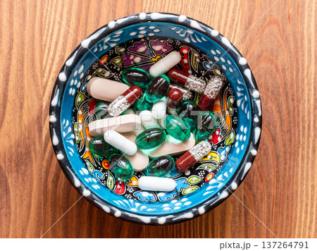 various pills in ornamental bowl cutout on table various pills in ornamental bowl cutout on table 137264791
