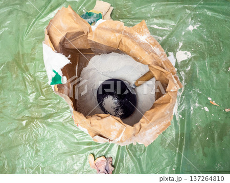 top view of paper bag of dry plaster mix top view of paper bag of dry plaster mix 137264810