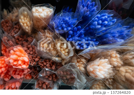 Multicolored dried flowers in the store. Multicolored dried flowers in the store. 137264820