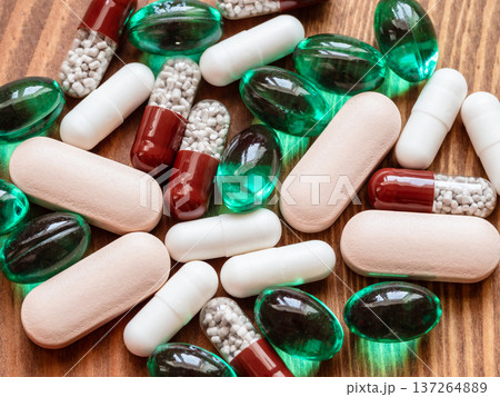 above view of many different pills on wooden table above view of many different pills on wooden table 137264889